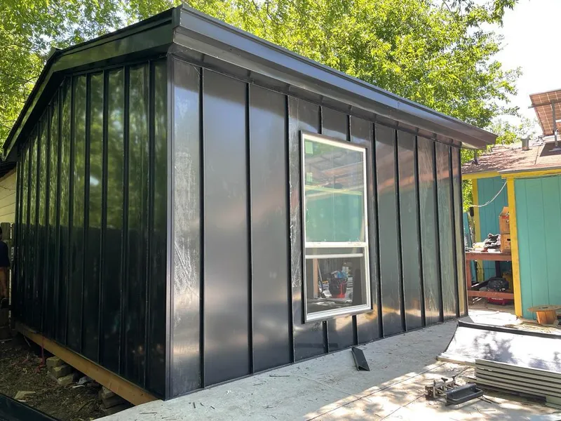 Black standing seam metal wall panels for Roof Inspection in East Providence